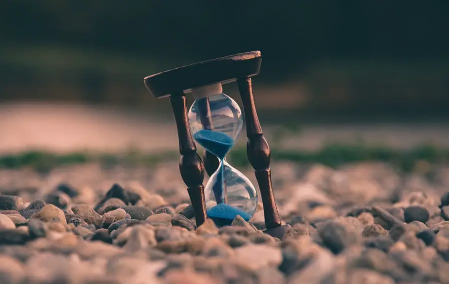 Hour glass in a bed of rocks