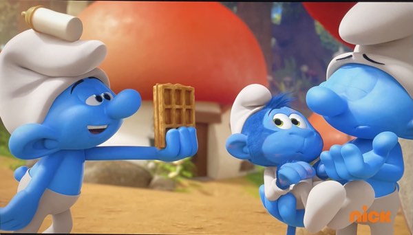 Monkey masquerading as Baby Smurf eats a waffle in front of Papa Smurf