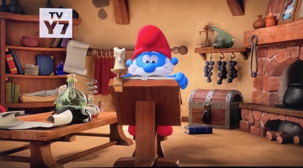 Papa Smurf sitting in his lab